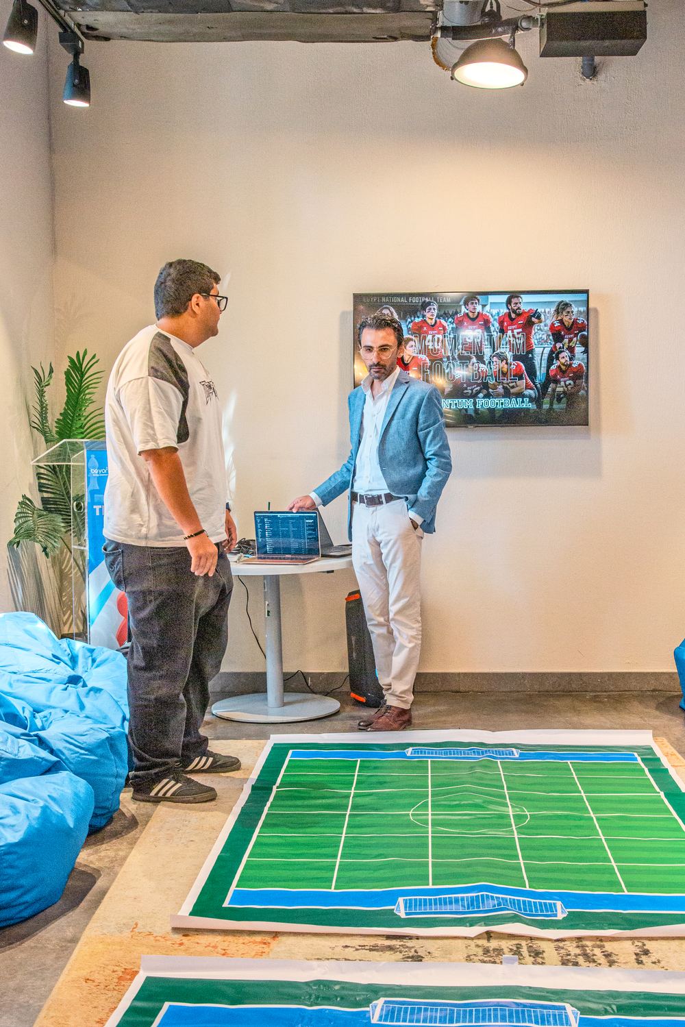 Participant stepping onto the Momentum Football pitch mat