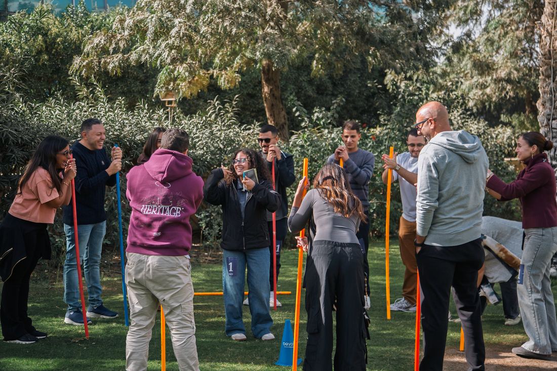Team holding poles together during a City Assemble challenge