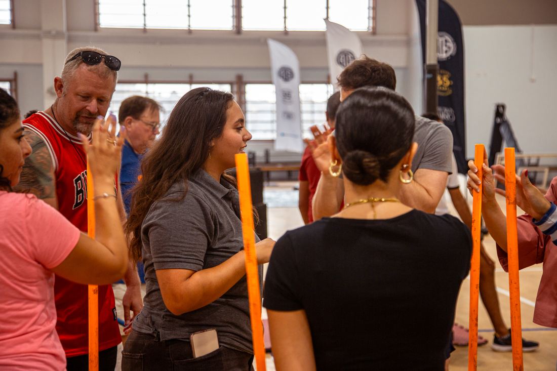 Team high-fiving during a City Assemble round